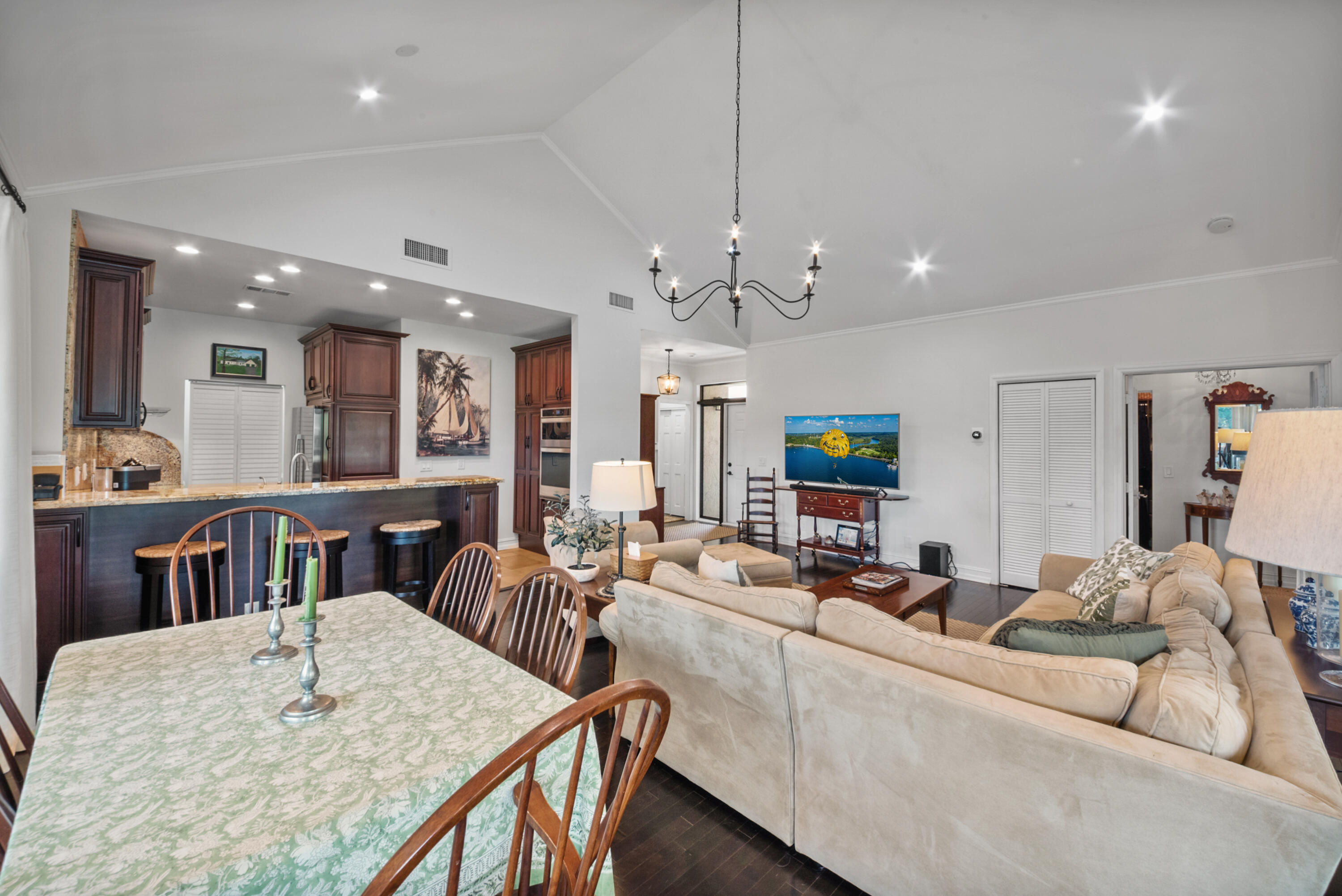 19199 Sabal Lake Drive Boca Raton, FL 33434 - Photo 5 of 40 a living room with furniture a flat screen tv and kitchen view