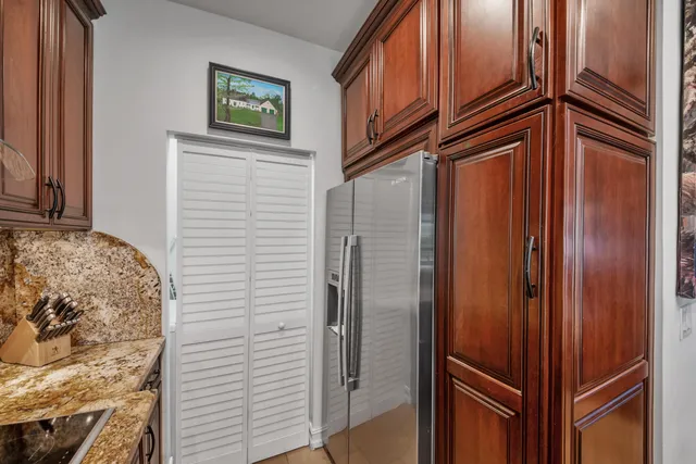a view of a kitchen counter top space cabinets and stainless steel appliances