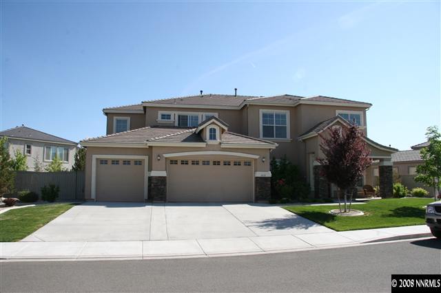1615 Silver Thread Drive Reno, NV 89521 - Photo 1 of 9 a front view of a house with a yard and garage