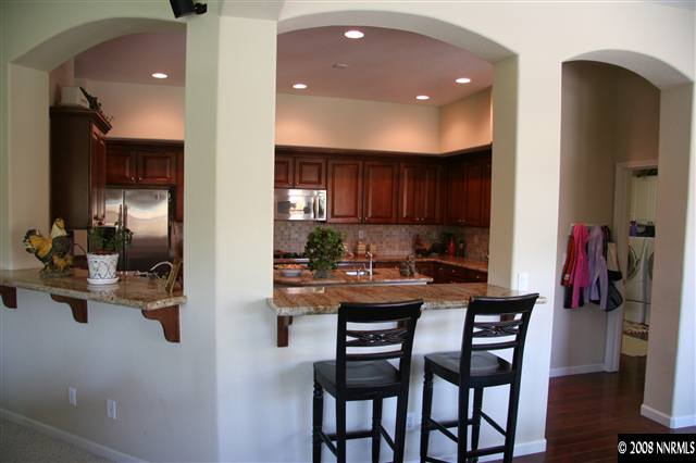 1615 Silver Thread Drive Reno, NV 89521 - Photo 3 of 9 a kitchen with a table and chairs in it