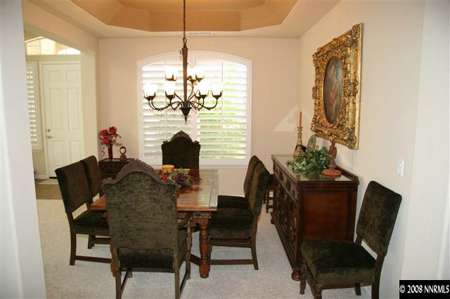 1615 Silver Thread Drive Reno, NV 89521 - Photo 4 of 9 a view of a dining room with furniture and chandelier