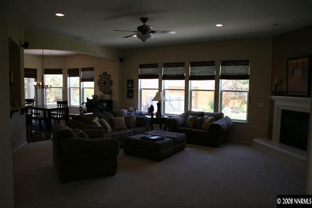 1615 Silver Thread Drive Reno, NV 89521 - Photo 7 of 9 a living room with furniture and a fireplace