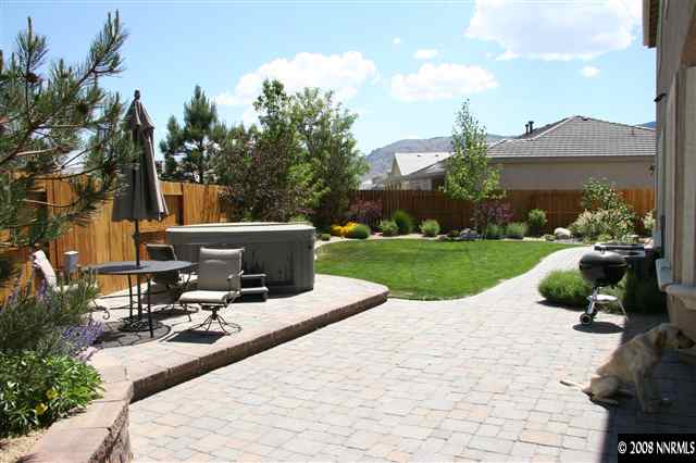 1615 Silver Thread Drive Reno, NV 89521 - Photo 8 of 9 a view of swimming pool with lounge chair and dinning table under an umbrella