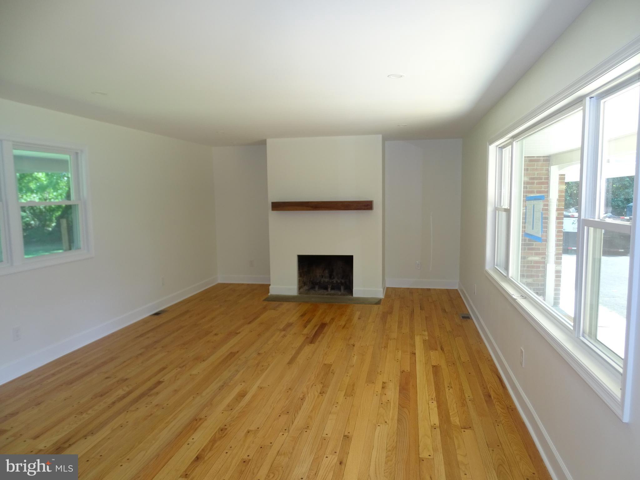 449 Street Road Warminster, PA 18974 - Photo 5 of 34 Living room hardwood floors and wood burning firep