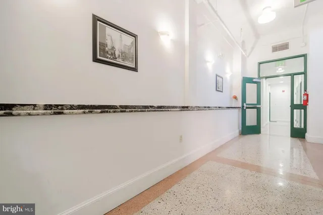 a view of a refrigerator in a kitchen