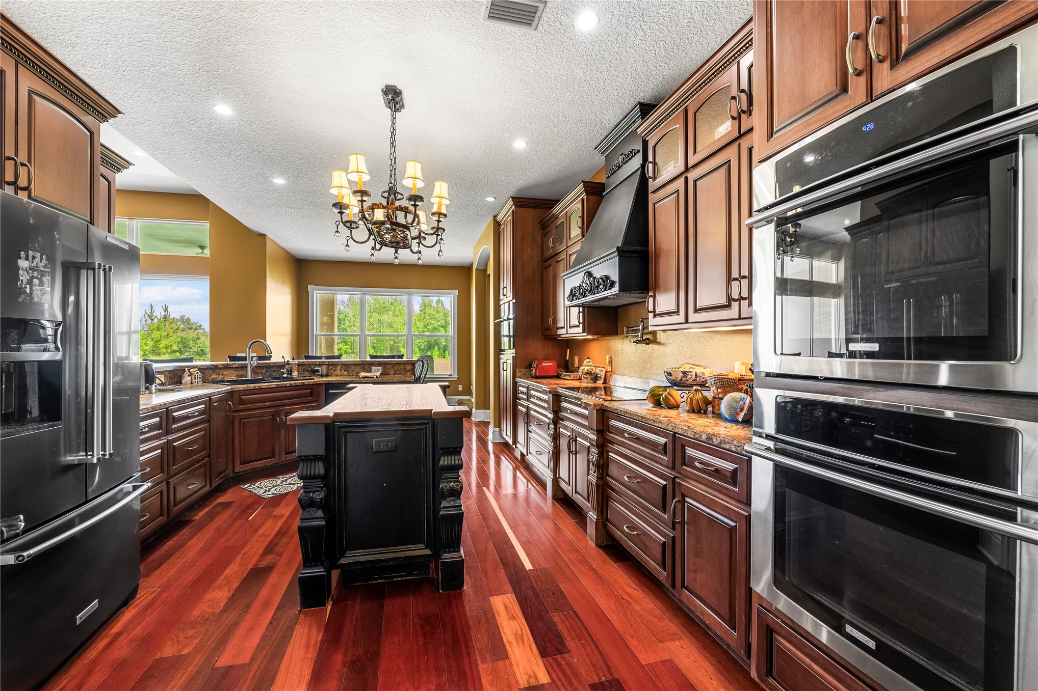 27247 Hallman Road Hilliard, FL 32046 - Photo 20 of 59 a kitchen with stove and microwave