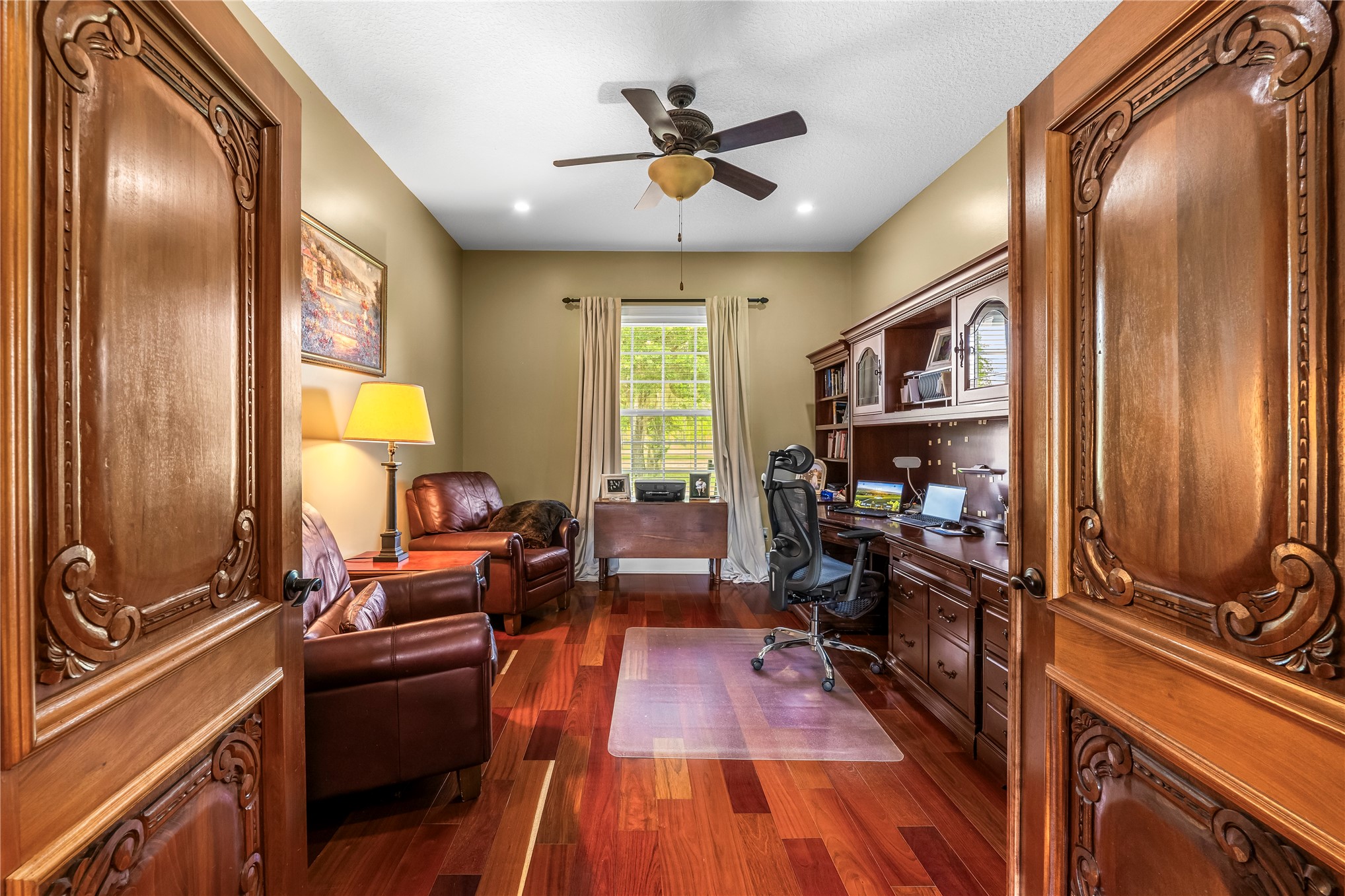 27247 Hallman Road Hilliard, FL 32046 - Photo 34 of 59 a living room with furniture fireplace and flat screen tv