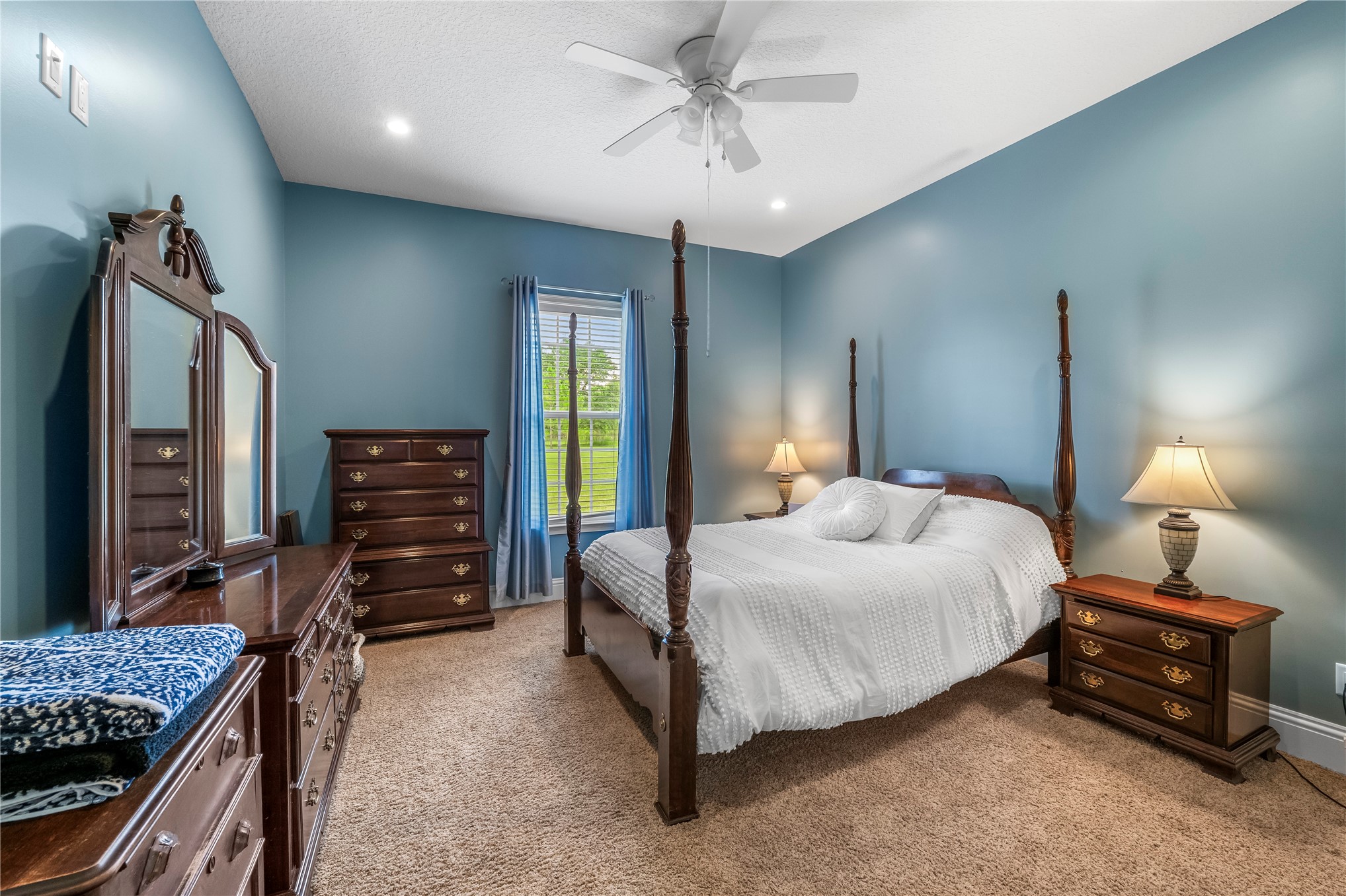27247 Hallman Road Hilliard, FL 32046 - Photo 36 of 59 a bedroom with a bed and a chandelier