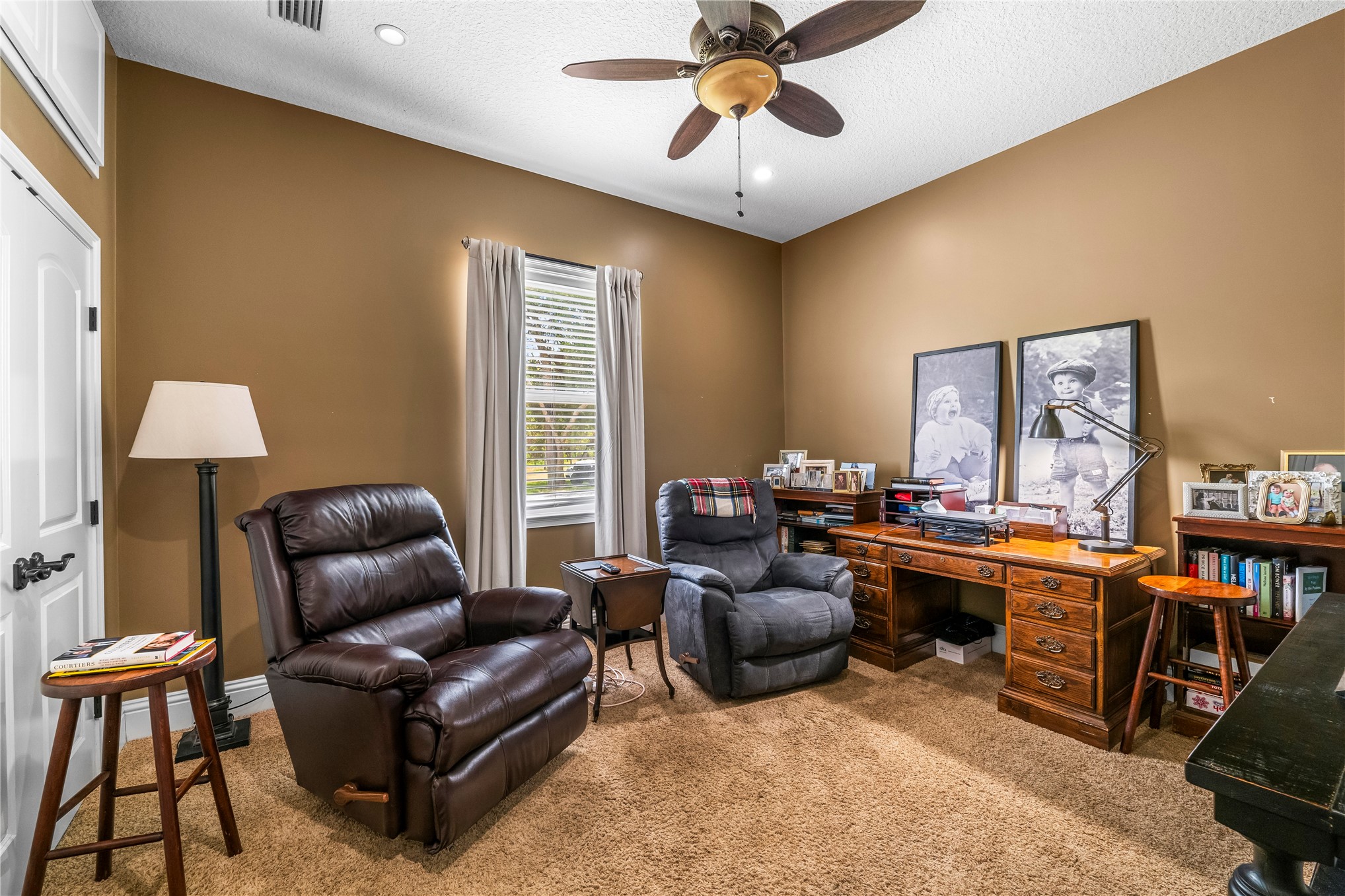 27247 Hallman Road Hilliard, FL 32046 - Photo 38 of 59 a living room with furniture ceiling fan and a window