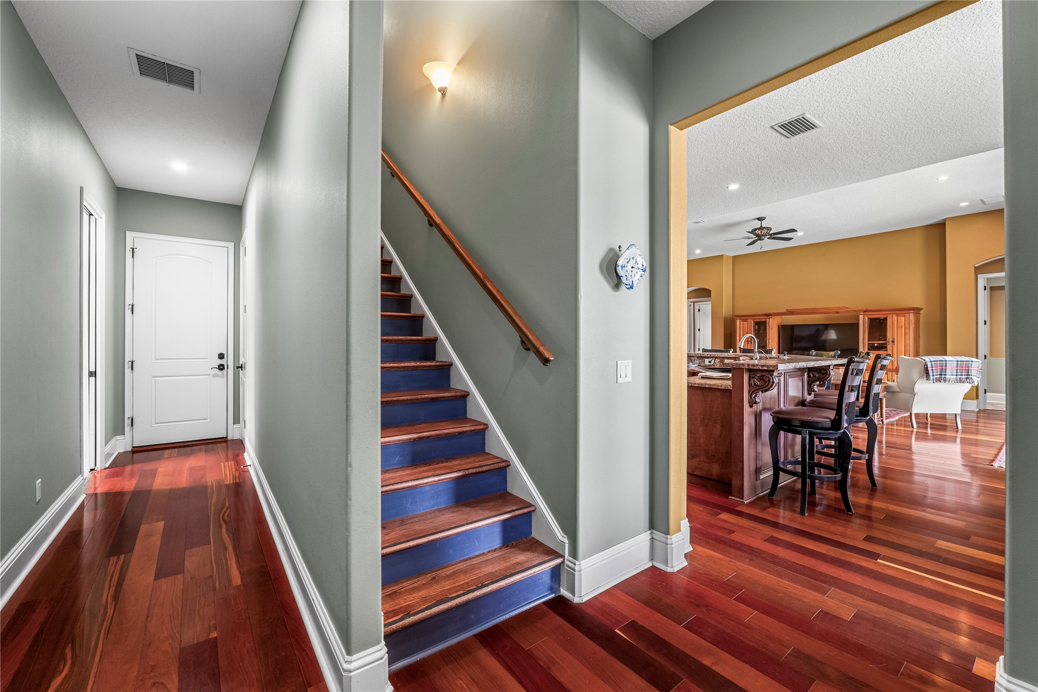 27247 Hallman Road Hilliard, FL 32046 - Photo 43 of 59 a view of a hallway with wooden floor and staircase