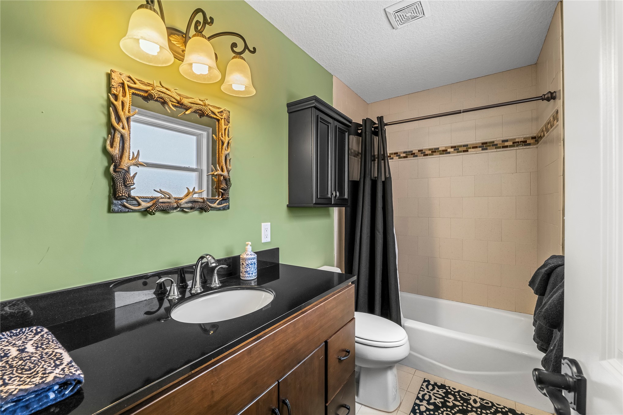 27247 Hallman Road Hilliard, FL 32046 - Photo 47 of 59 a bathroom with a granite countertop sink toilet and shower
