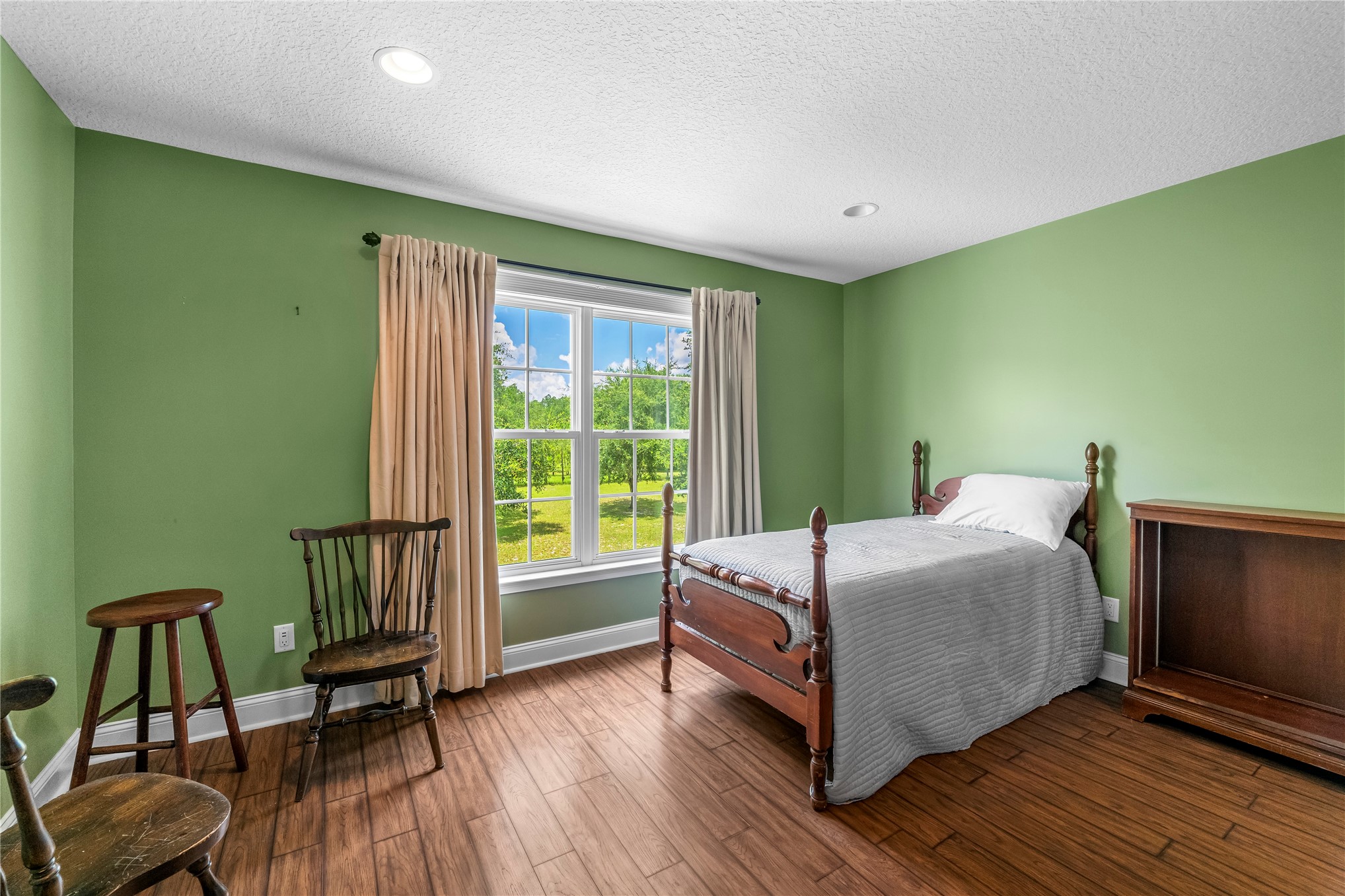 27247 Hallman Road Hilliard, FL 32046 - Photo 48 of 59 a bedroom with a bed and a window