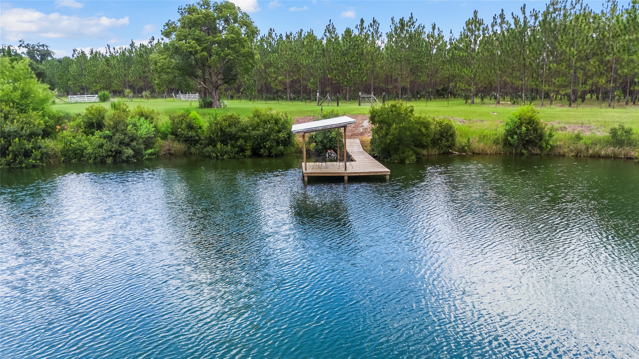 27247 Hallman Road Hilliard, FL 32046 - Photo 53 of 59 a view of a lake with a yard