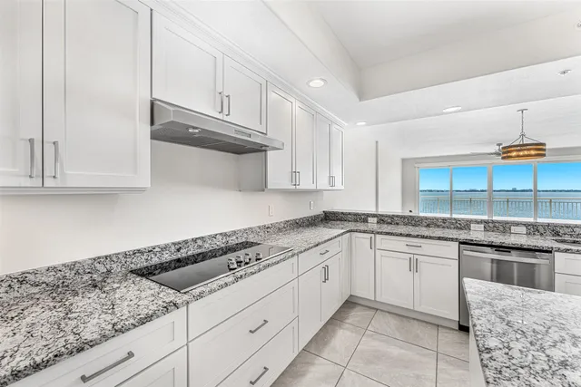 a view of a livingroom with a ceiling fan and window