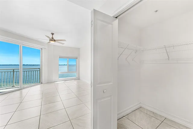 a bathroom with a shower and a glass door