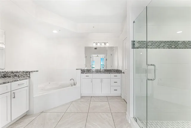 a view of a swimming pool with outdoor seating