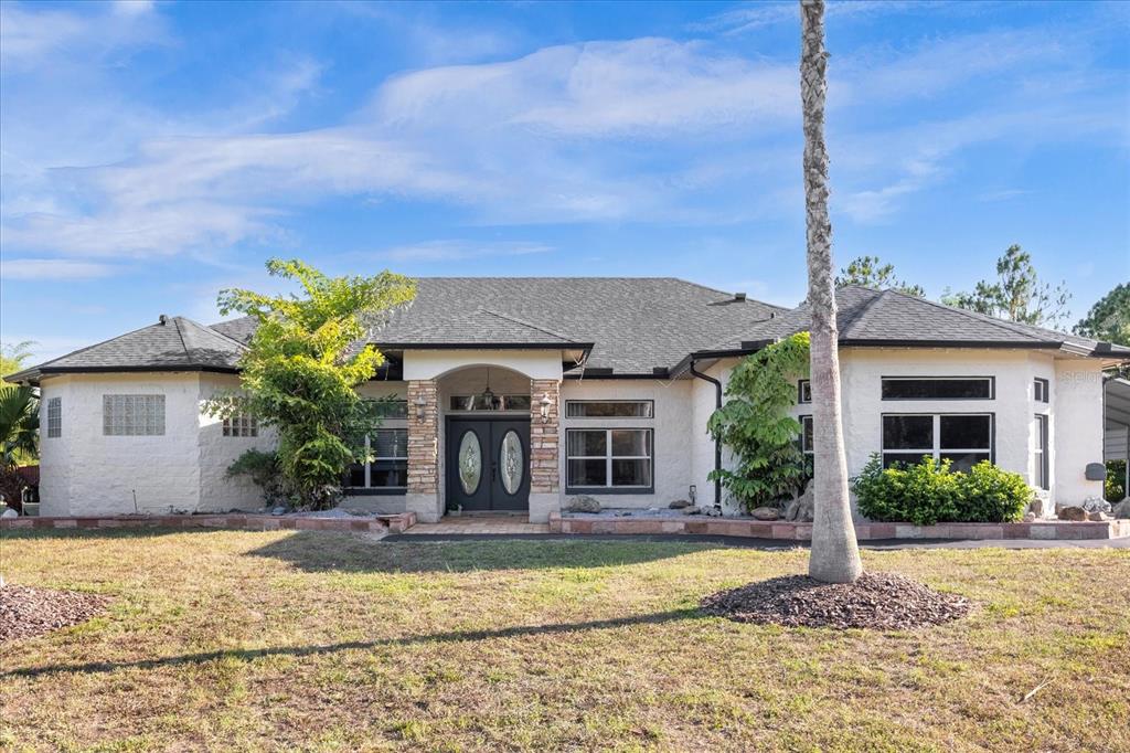 a front view of a house with garden