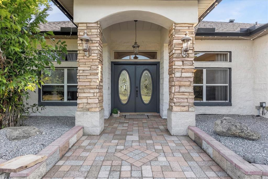 2975 West Osceola Road Geneva, FL 32732 - Photo 12 of 45 a front view of a house with garden