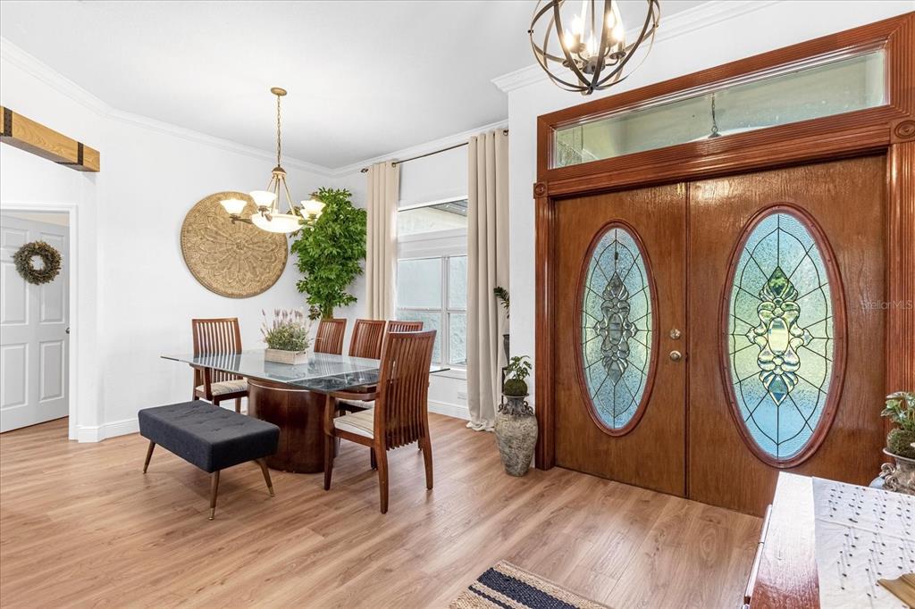 2975 West Osceola Road Geneva, FL 32732 - Photo 13 of 45 a view of a dining room with furniture and wooden floor