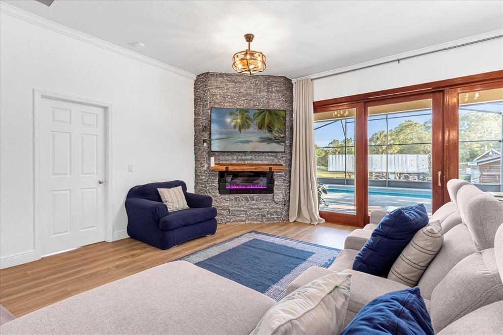 2975 West Osceola Road Geneva, FL 32732 - Photo 21 of 45 a living room with furniture and a fireplace