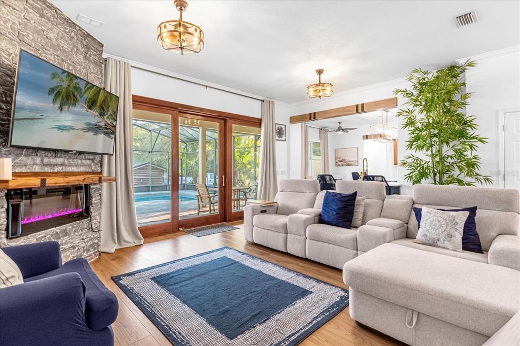 2975 West Osceola Road Geneva, FL 32732 - Photo 22 of 45 a living room with furniture and a fireplace