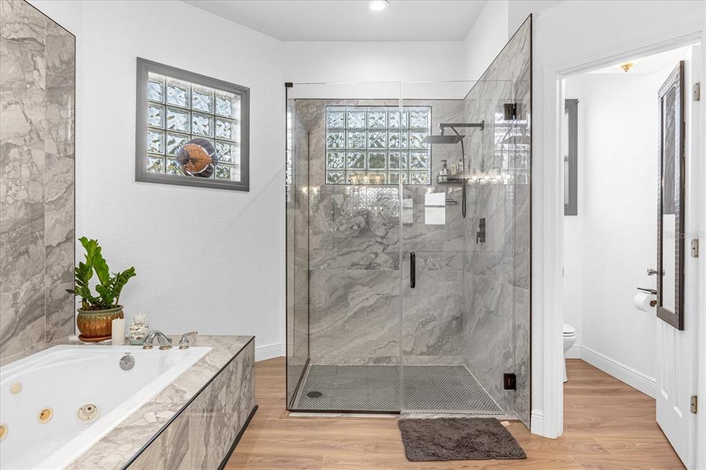 2975 West Osceola Road Geneva, FL 32732 - Photo 28 of 45 a bathroom with a tub shower and sink