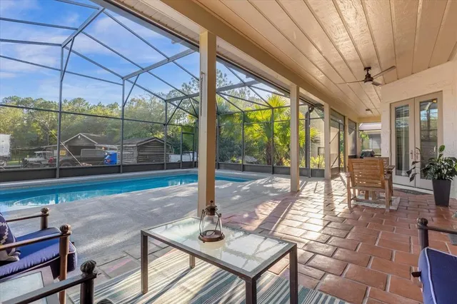 a view of a swimming pool with a patio