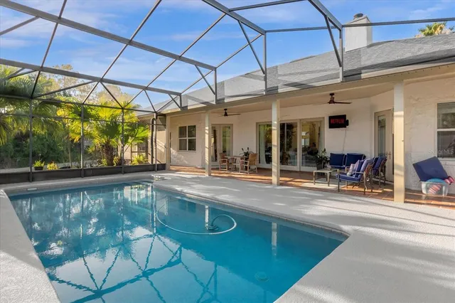 a view of a swimming pool with a porch