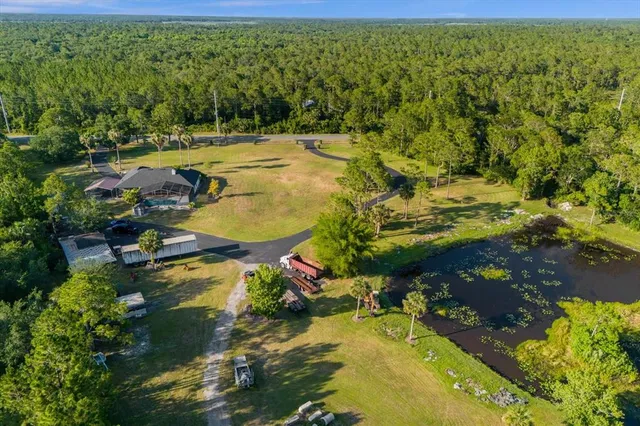 a view of a swimming pool with a yard