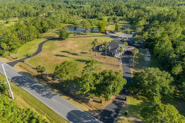 a view of a lake with a yard