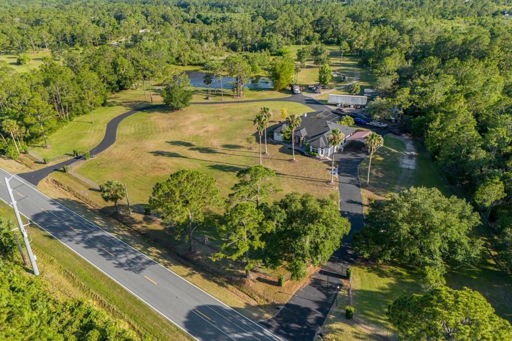 2975 West Osceola Road Geneva, FL 32732 - Photo 10 of 45 a view of a swimming pool with a yard