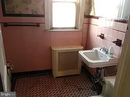 a utility room with a sink a washer and dryer