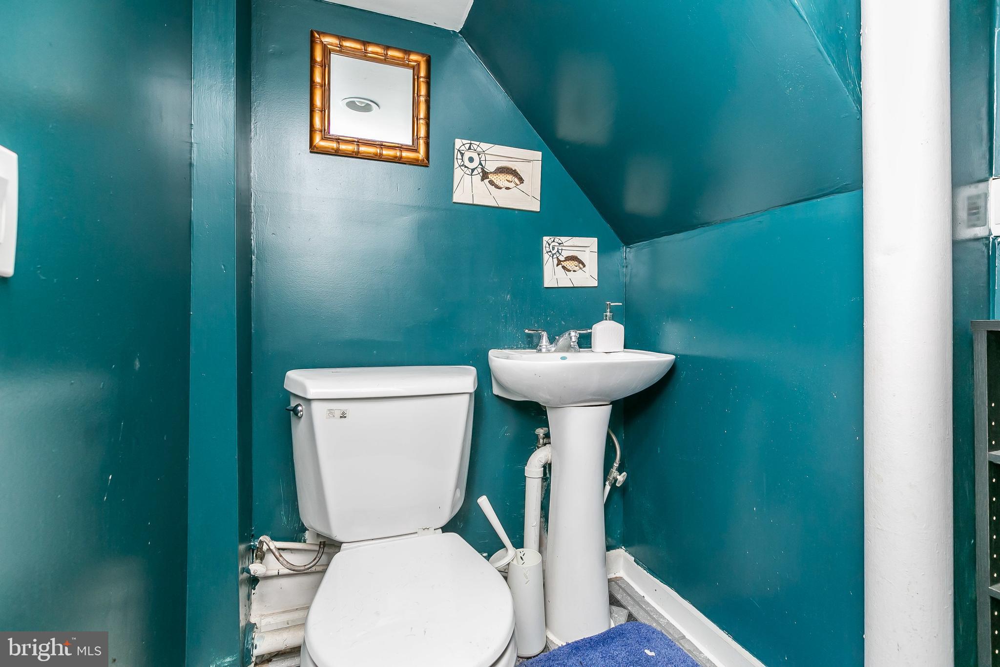 7467 Berkshire Road Baltimore, MD 21222 - Photo 21 of 26 Step up half bath in basement