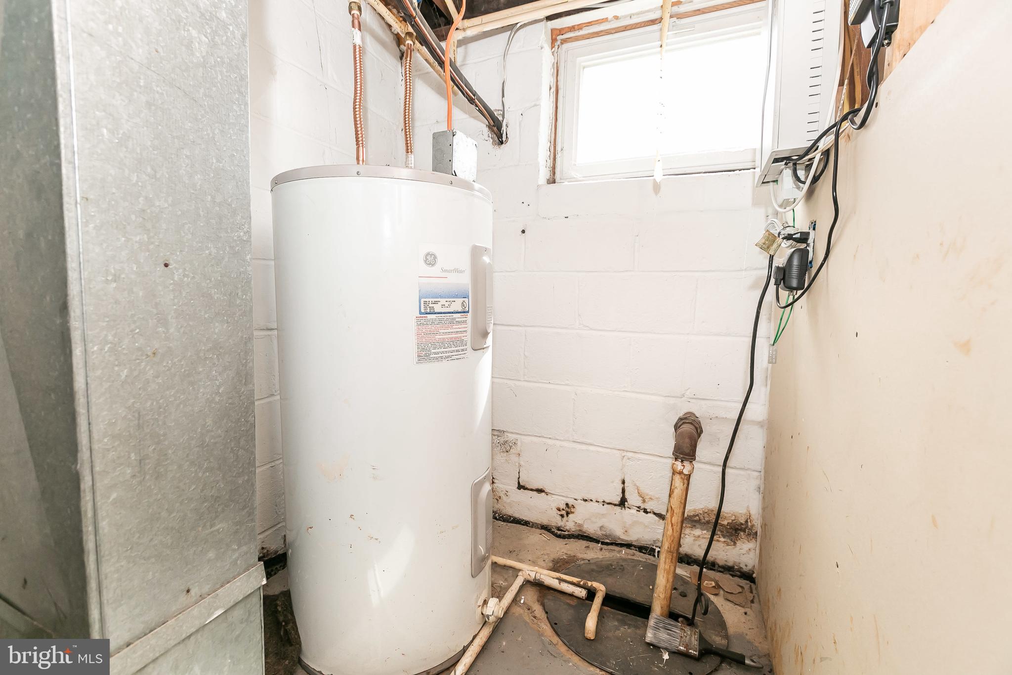 7467 Berkshire Road Baltimore, MD 21222 - Photo 24 of 26 Water heater, updated basement window