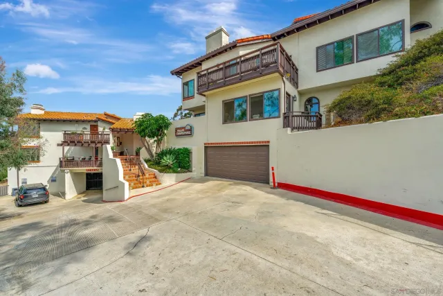 a view of garage with large tree