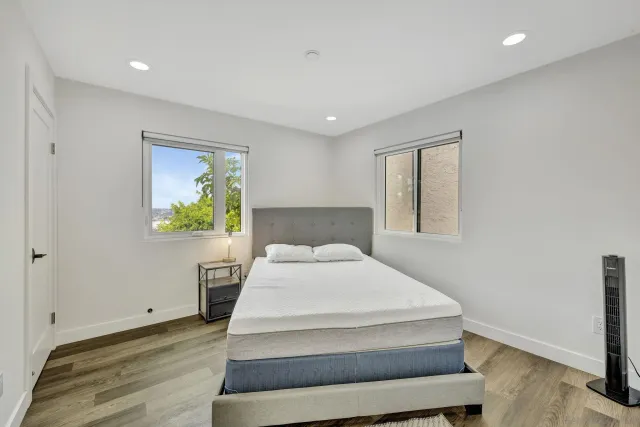 a bed room with a bed and a window