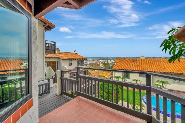 a view of a balcony with furniture
