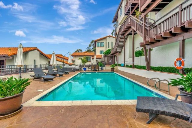 a view of an chairs and table in the patio
