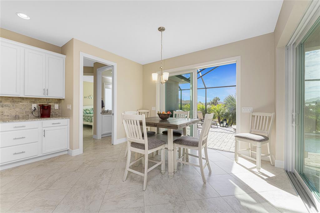 199 Marker Road Rotonda West, FL 33947 - Photo 14 of 55 a view of a dining room with furniture window and outside view