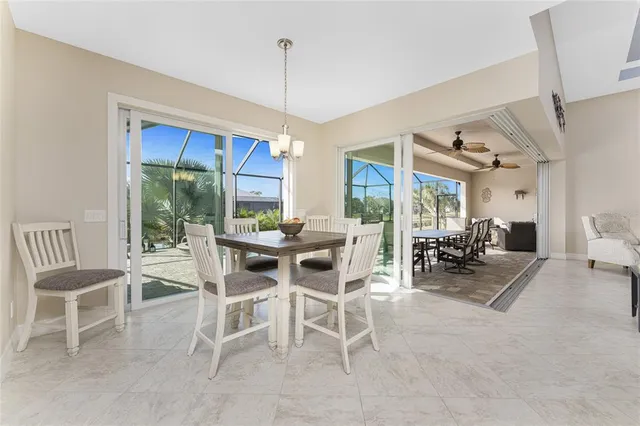 a kitchen with kitchen island granite countertop a sink a center island and appliances