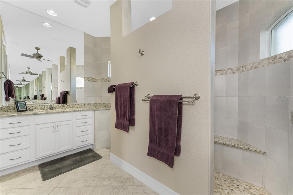 199 Marker Road Rotonda West, FL 33947 - Photo 27 of 55 a spacious bathroom with a shower and a sink
