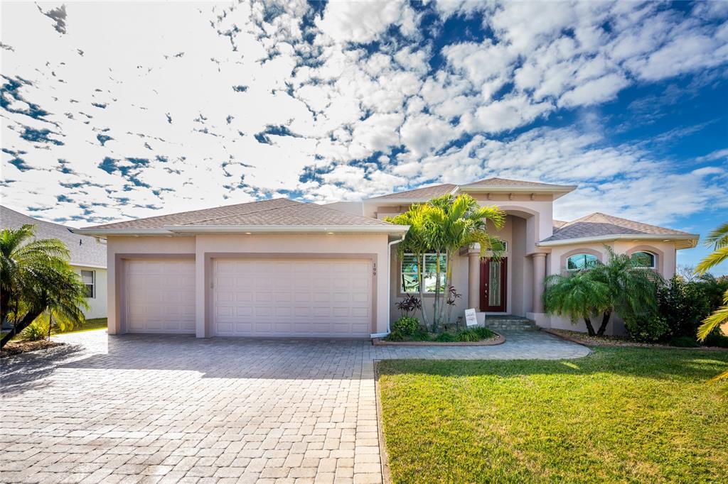 199 Marker Road Rotonda West, FL 33947 - Photo 3 of 55 a view of a house with a swimming pool