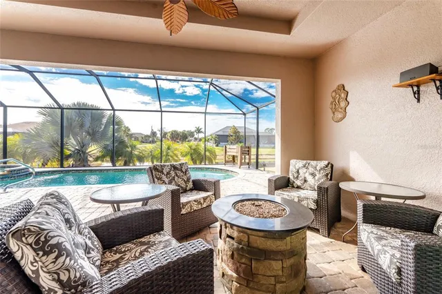 a view of a swimming pool with a patio