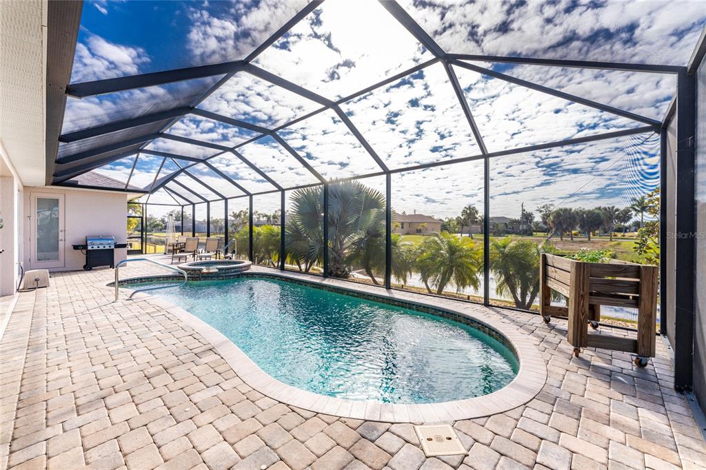 199 Marker Road Rotonda West, FL 33947 - Photo 41 of 55 a view of a swimming pool with a patio