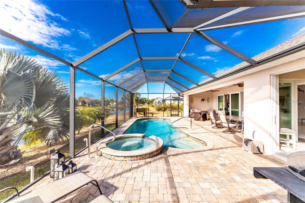 199 Marker Road Rotonda West, FL 33947 - Photo 43 of 55 a view of a backyard with swimming pool and sitting area