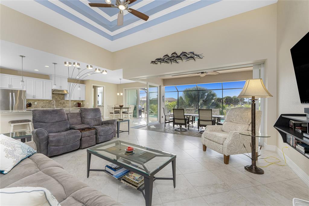 199 Marker Road Rotonda West, FL 33947 - Photo 6 of 55 a living room with furniture kitchen view and a large window