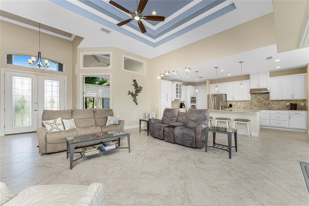 199 Marker Road Rotonda West, FL 33947 - Photo 8 of 55 a living room with furniture and a large window