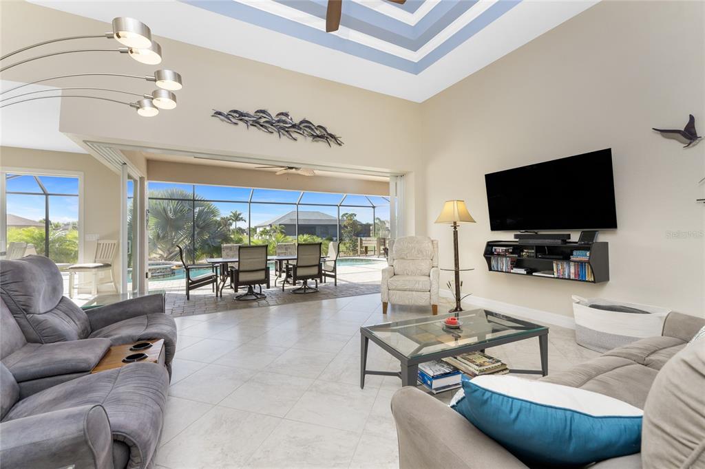 199 Marker Road Rotonda West, FL 33947 - Photo 10 of 55 a living room with furniture and a flat screen tv