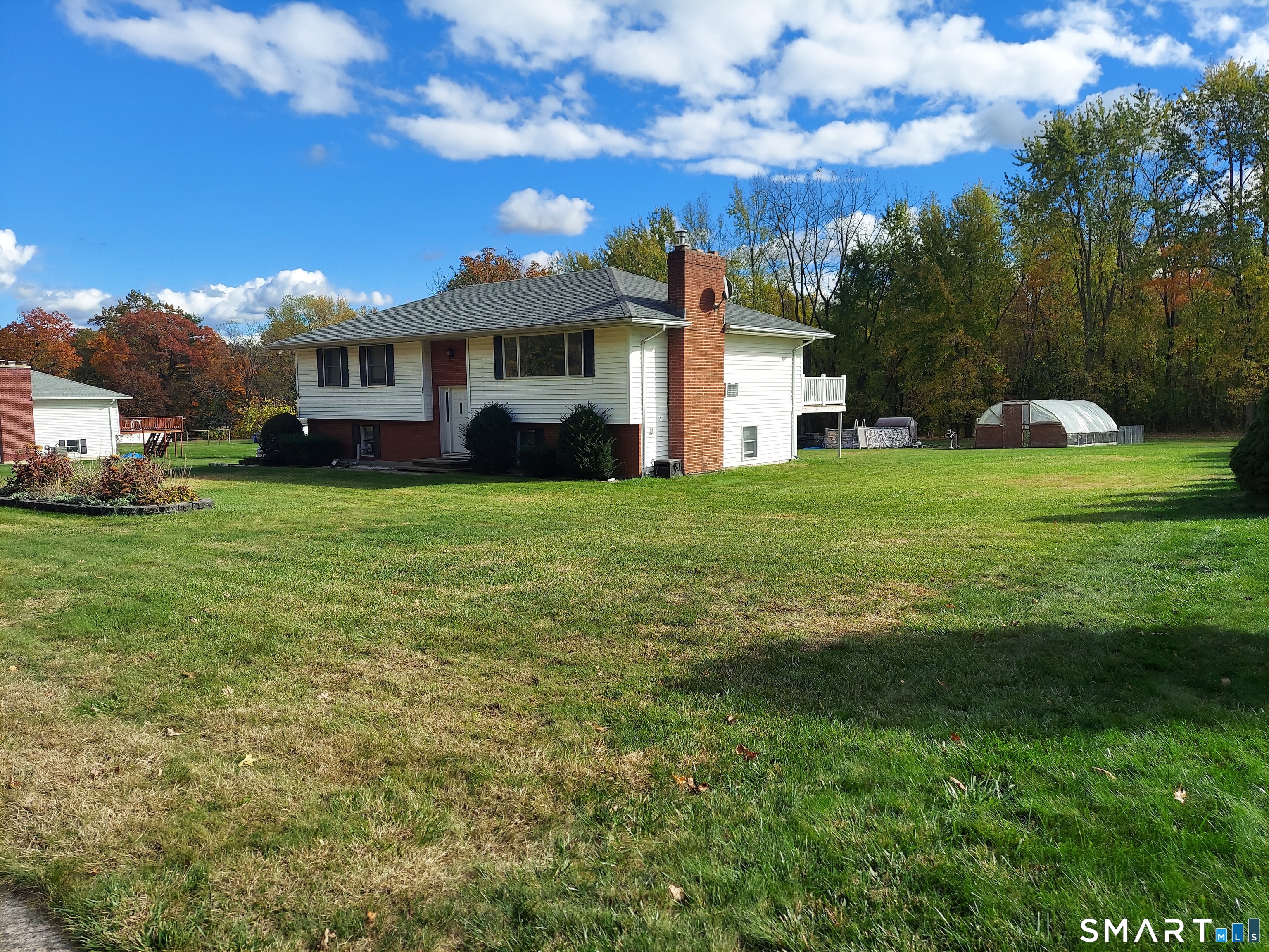 95 Abbe Road Enfield, CT 06082 - Photo 1 of 2 a view of a house with a big yard