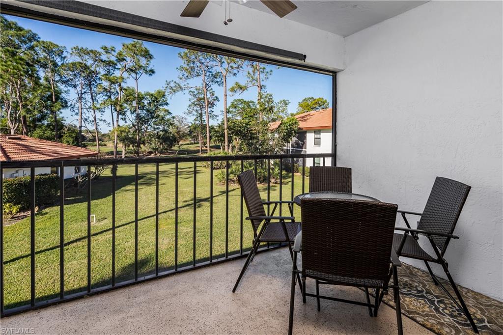 905 Augusta Boulevard, Unit 7 Naples, FL 34113 - Photo 11 of 42 a view of a chairs and table in patio